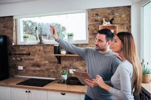 Couple designing their new kitchen style