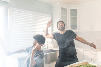 Cooking in a poorly ventilated kitchen that is in need of a high-quality range hood.