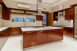 a modern sleek kitchen with an island range hood