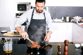 Man cooking a stir fry in the kitchen